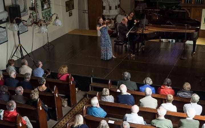 Tamsin Waley-Cohen and audience in St Brendans Church