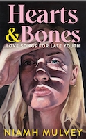The cover of Niamh Mulvey's novel has the title Hearts & Bones in large pink writing and the subtitle Love Songs for Late Youth in smaller writers. There is an illustration of a woman in her twenties or thirties. She has blond hair and her hand is shielding her eyes from the sun as she looks at something we cannot see
