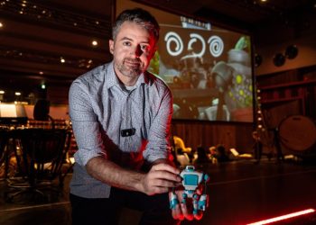 Weekend Marking: XX Vickie Maye: 13/02/25  Acclaimed comic book artist and Marvel animator Will Sliney pictured holding a figurine based on his new short as the orchestra at the Cork school of music records the live soundtrack for the animation in the background. picture Chani Anderson