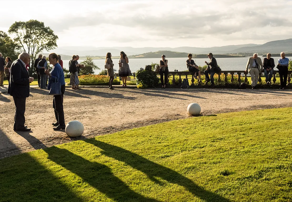West Cork Music Festival Audience in the sun outside Bantry House