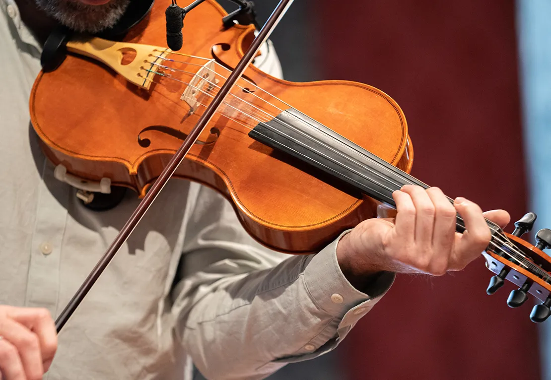 Close up of a young musician playing violin at a West Cork Concert