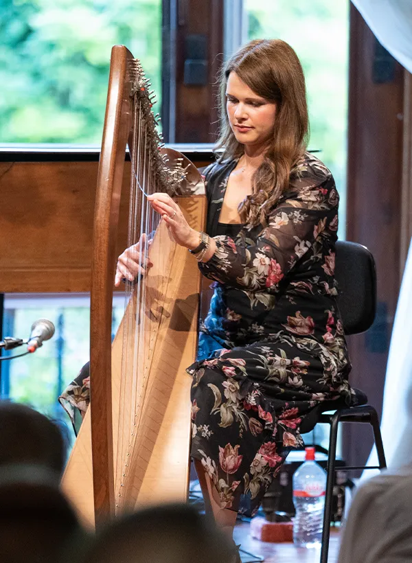 Playing harp on stage